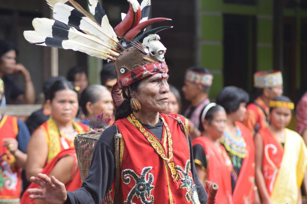 GLOBAL SUMMIT Vibrant celebration of Dayak culture with traditional costumes and rituals in Kalimantan Barat, Indonesia.